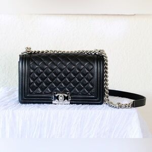 Authentic Chanel Perforated Lambskin quilted New Medium Le boy Flap in Black.